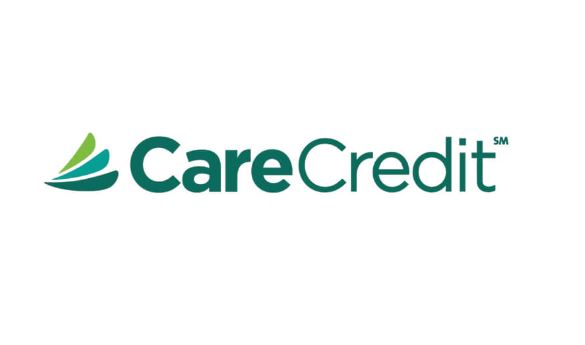 A green and white logo of care credit.